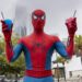 Spider-Man holding two spider drinks in Sydney for the Brand New Day fan pop-up