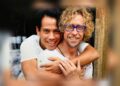 Roberto Meza Mont embraces Craig Ruddy in a publicity photograph for A Portrait of Love