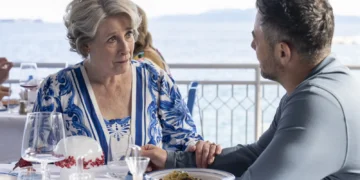 Joe Mottram speaks with Elena at an Italian seaside restaurant