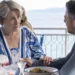 Joe Mottram speaks with Elena at an Italian seaside restaurant