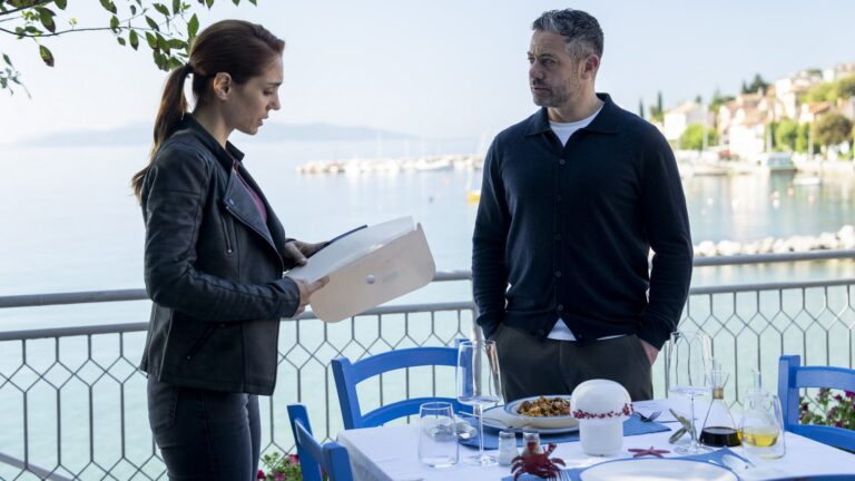 Lara Sarrancino and Joe Mottram on a waterfront terrace in A Taste For Murder on Channel 7