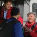 Characters in skydiving gear beside a plane in Beyond Paradise on ABC