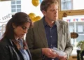 Two Beyond Paradise characters examine evidence