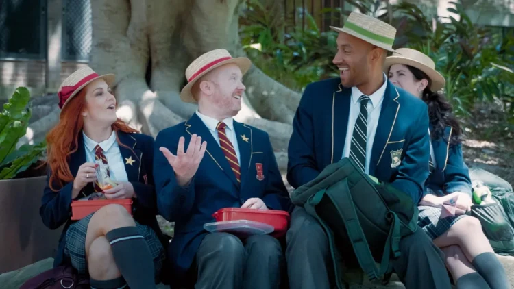 The cast in school uniforms and boaters in Class Clowns on ABC