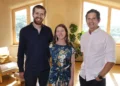 The host with homeowners in a sunlit room in Grand Designs New Zealand on ABC