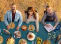The Recipe of the Year hosts and judges at a table of dishes on ABC