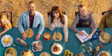 The Recipe of the Year hosts and judges at a table of dishes on ABC