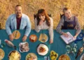 Recipe of the Year hosts and judges seated at a table of dishes on ABC