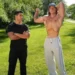Two men talk outdoors in The State of Man