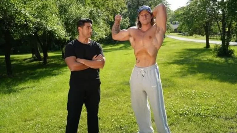 Two men talk outdoors in The State of Man