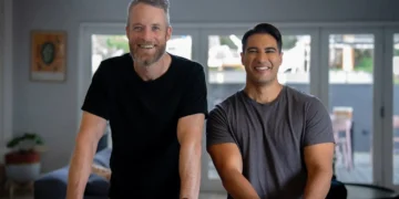 Two men stand in a living room in The State of Man on ABC