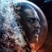 Idris Elba as an astronaut surrounded by space and water in Above the Below