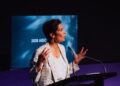 Speaker addresses the 2026 AIDC conference at a lectern
