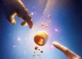 Two hands reaching toward a glowing object in the official Allen teaser art