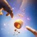 Two hands reaching toward a glowing object in the official Allen teaser art