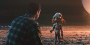 Petey and Allen face each other on a moonlit beach