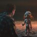 Petey and Allen face each other on a moonlit beach