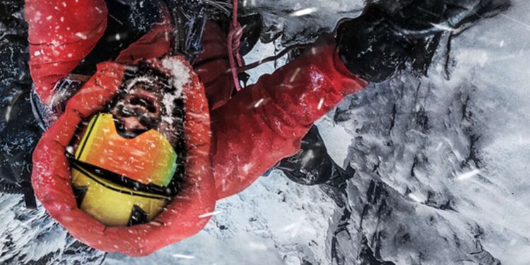 Climber in red winter gear on an icy slope in The Last First: Winter K2 publicity image