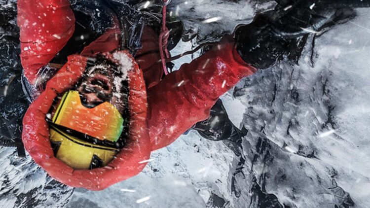 Climber in red winter gear on an icy slope in The Last First: Winter K2 publicity image