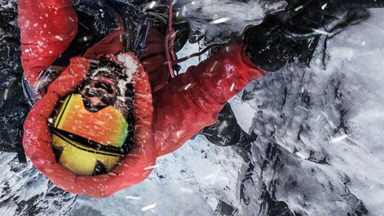 Climber in red winter gear on an icy slope in The Last First: Winter K2 publicity image