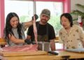 Awkwafina prepares food with two chefs in The Unlikely Cook