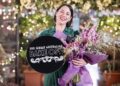 Pamela Buchanan holding her Great Australian Bake Off winner trophy and flowers