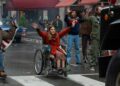Ruth Madeley as Judy Heumann leads fellow protesters in Being Heumann