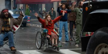 Ruth Madeley as Judy Heumann leads fellow protesters in Being Heumann