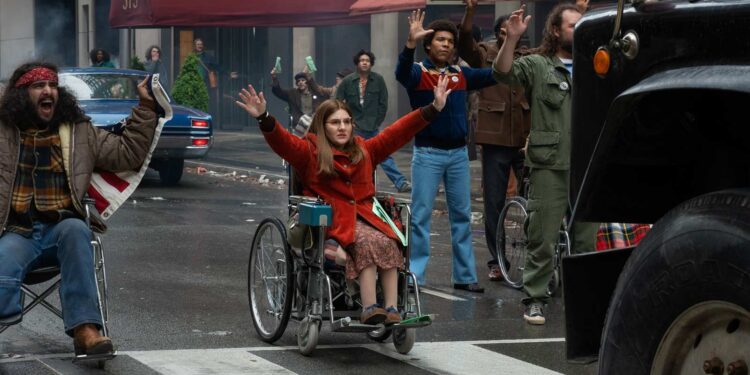 Ruth Madeley as Judy Heumann leads fellow protesters in Being Heumann