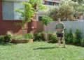 Charlie stands in the completed family garden on Better Homes and Gardens