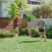 Charlie stands in the completed family garden on Better Homes and Gardens