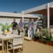 Adam and Charlie beside the curved pergola and outdoor dining area on Better Homes and Gardens