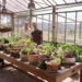 Johanna and Troy Rhoades-Brown in Troy's greenhouse on Better Homes and Gardens