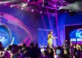 Big Brother host Mel Tracina on stage at the Big Brother 2026 launch
