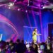 Big Brother host Mel Tracina on stage at the Big Brother 2026 launch