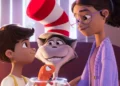 The Cat in the Hat smiles between Gabby and Sebastian in the animated film
