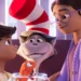 The Cat in the Hat smiles between Gabby and Sebastian in the animated film