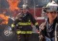 Firefighters in front of a burning fire truck in Chicago Fire season 14 on Channel 7