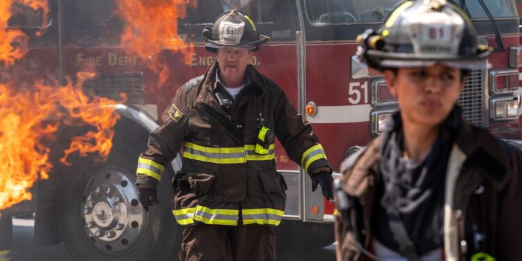 Firefighters in front of a burning fire truck in Chicago Fire season 14 on Channel 7