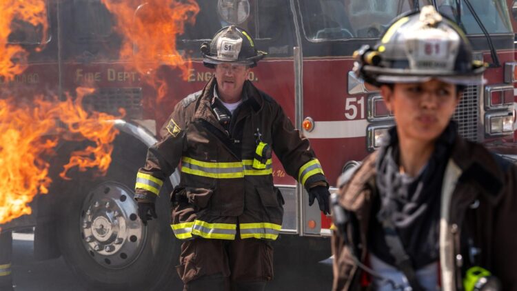 Firefighters in front of a burning fire truck in Chicago Fire season 14 on Channel 7