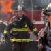 Firefighters in front of a burning fire truck in Chicago Fire season 14 on Channel 7
