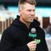 David Warner speaking into a Kayo Sports microphone