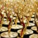 Rows of gold Emmy Award statuettes