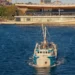 Fishing boat approaching the Sydney Fish Market waterfront
