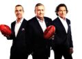Eddie McGuire with fellow Footy Classified panellists holding Sherrin footballs
