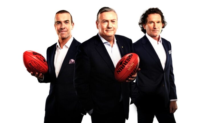Eddie McGuire with fellow Footy Classified panellists holding Sherrin footballs