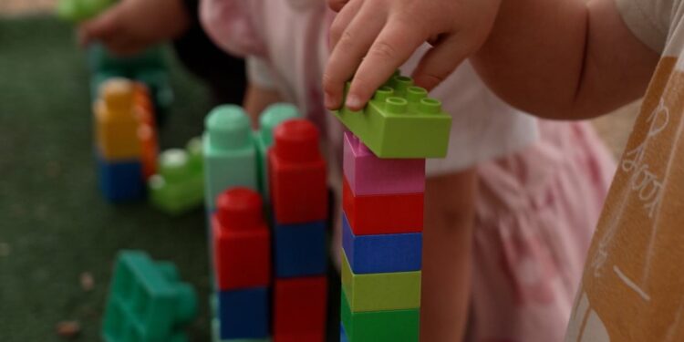 Child playing with blocks in Four Corners Monstrous