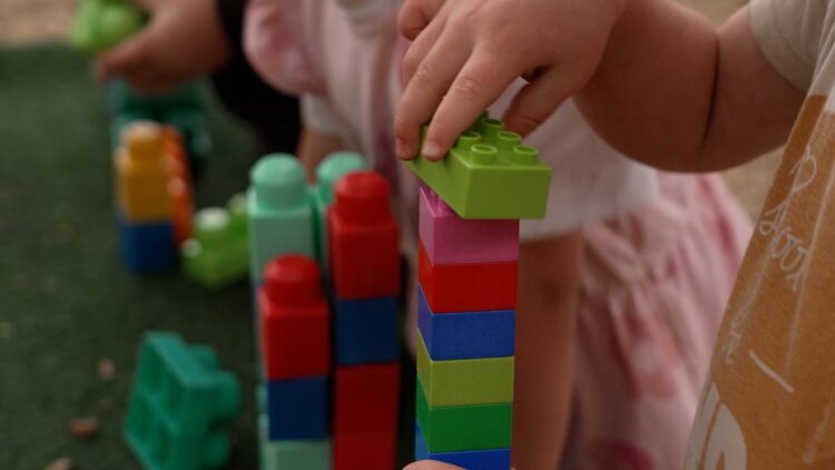 Child playing with blocks in Four Corners Monstrous
