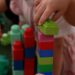 Child playing with blocks in Four Corners Monstrous