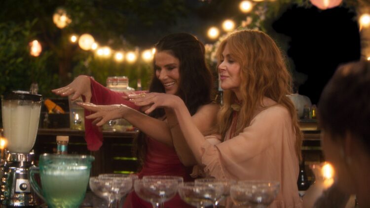 Sandra Bullock and Nicole Kidman cast a spell at an outdoor party in Practical Magic 2